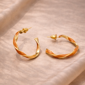 Studio-style image of Niv earring against an aesthetic background